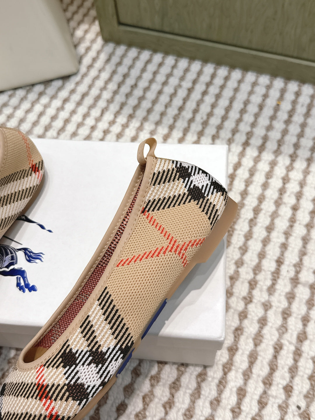 Burberry check ballet flats close-up, tan trim and rounded instep opening