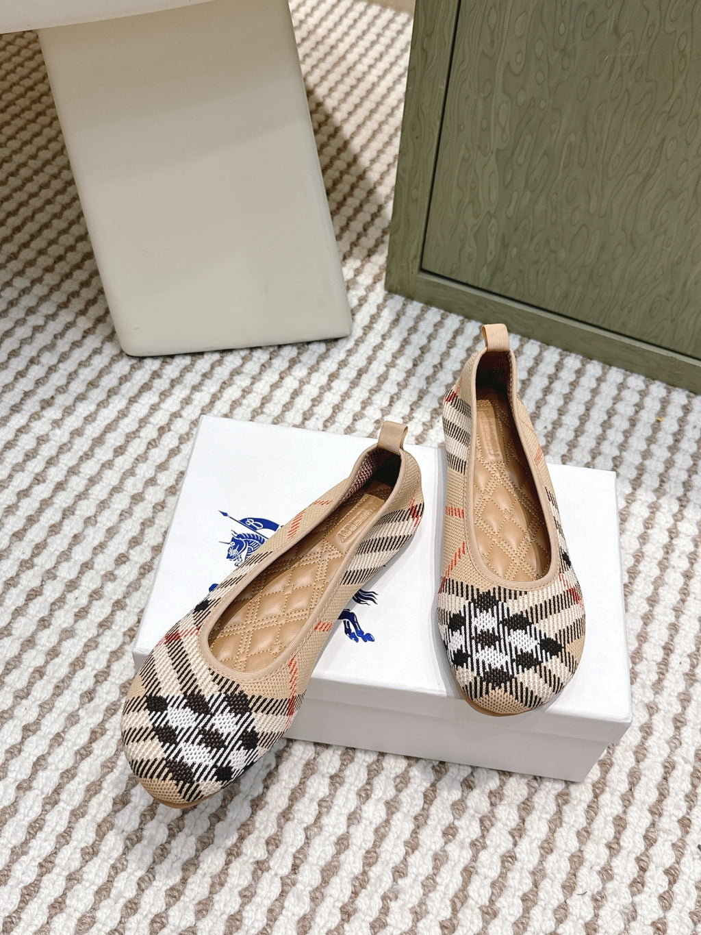 Burberry check ballet flats pair with tan leather lining and low rounded toe