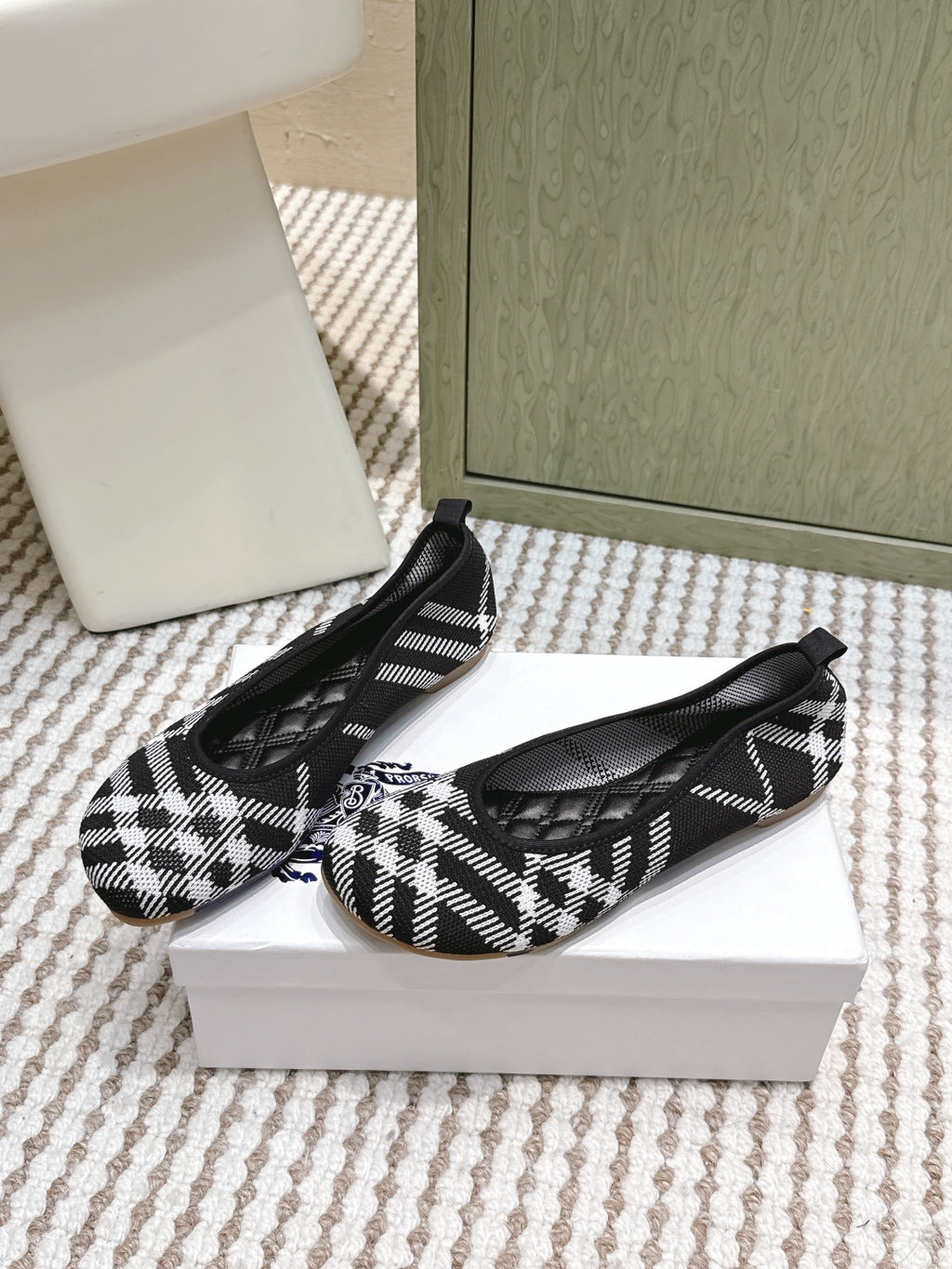 Burberry check-pattern slip-on shoes, black and white, with curved toe seam