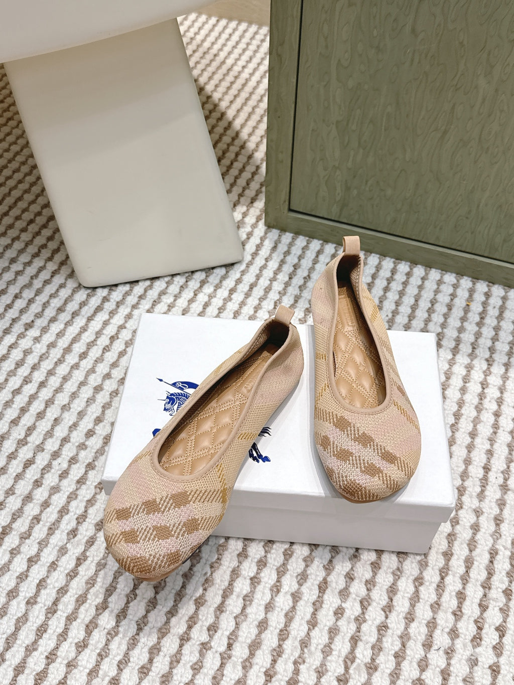 Burberry slip-on flats with check pattern and blue bow accent, beige