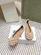 Burberry slip-on flats with check pattern and blue bow accent, beige