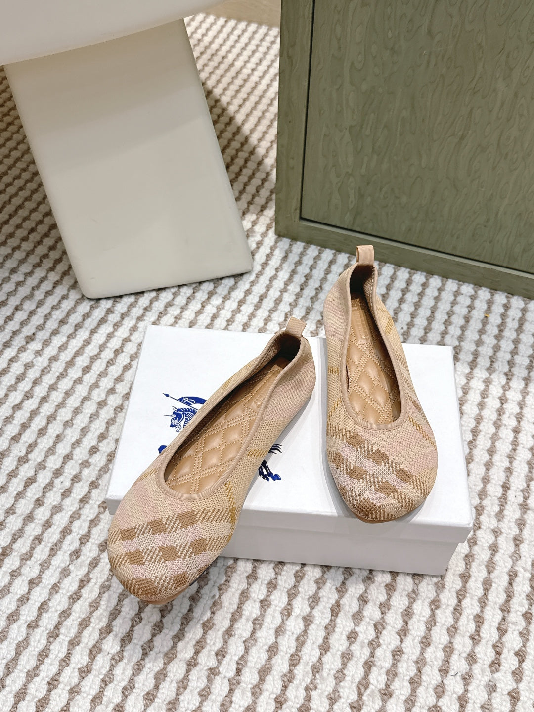 Burberry slip-on flats with check pattern and blue bow accent, beige