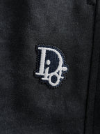 Dior pants logo patch on dark fabric near hip