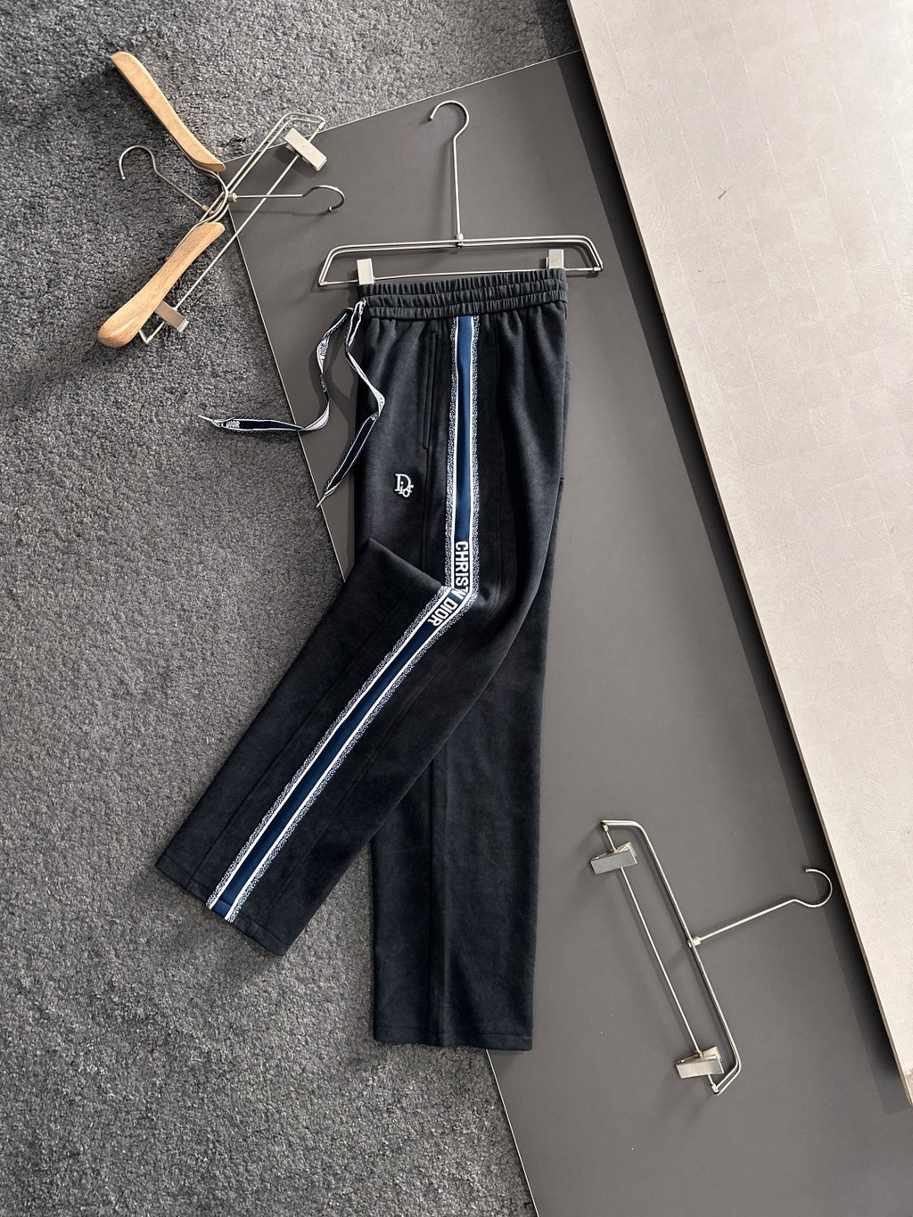 Dior pants with elastic waist and drawstring, dark legs with blue side stripe detail