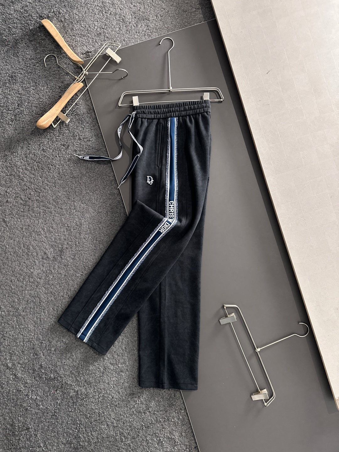Dior pants with elastic waist and drawstring, dark legs with blue side stripe detail