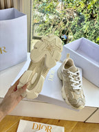 Beige lace-up sneakers with star-shaped tread and patterned uppers