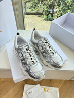 Ladies' gray lace-up sneakers with patterned design, displayed in a box