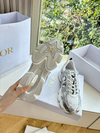 Ladies' sneaker sole with star emblem and tread, with one shoe shown