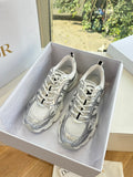 Ladies' gray lace-up sneakers with patterned paneling in a shoe box