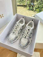 Ladies' gray lace-up sneakers with patterned paneling in a shoe box