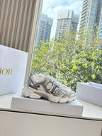 Ladies' gray lace-up sneaker on a box, with textured upper and thick sole