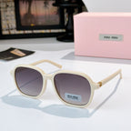 MiuMiu cream sunglasses with dark lenses and gold-tone hinges; logo on temple.
