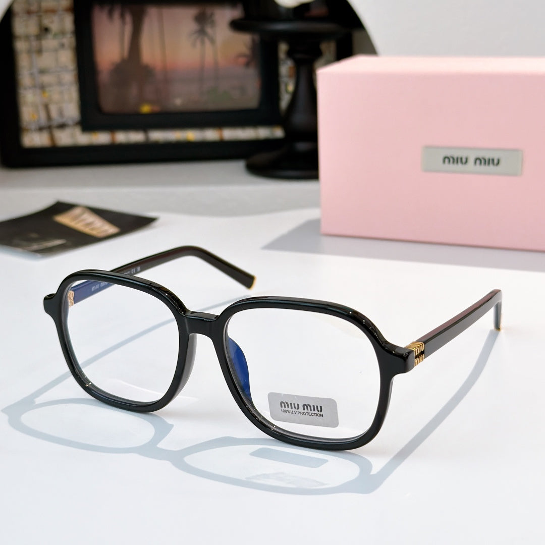 MiuMiu black sunglasses with blue-tinted lenses and gold-tone hinges; logo on temple.