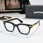 Black eyeglasses with clear lenses and gold-accented temple tips.