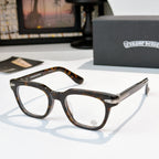 Brown tortoise eyeglasses with clear lenses and metallic temple detailing.