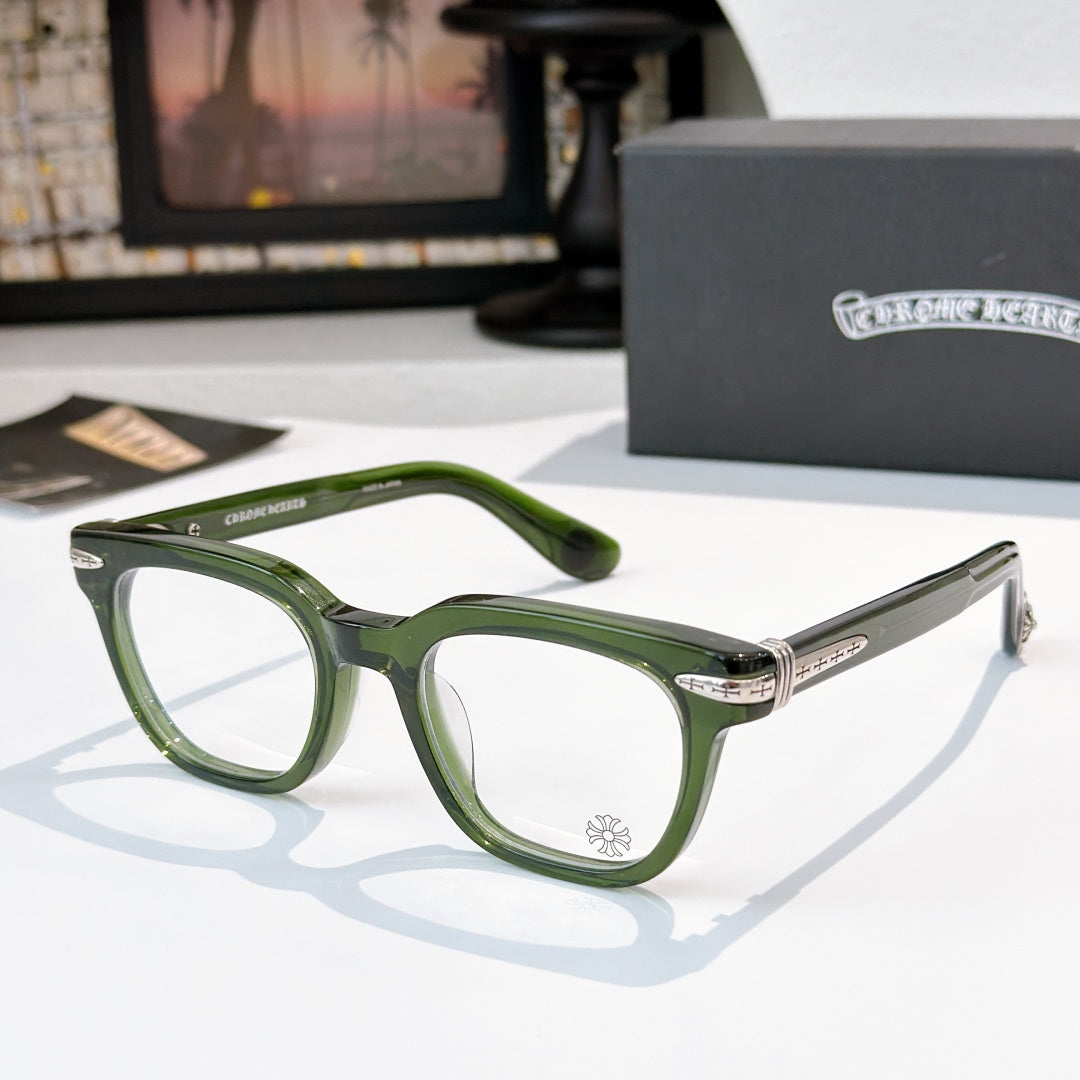 Green square eyeglasses with clear lenses and metal temple tips.