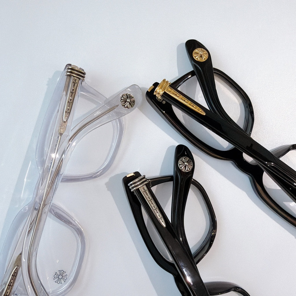Black and transparent eyeglasses with clear lenses, shown side by side.