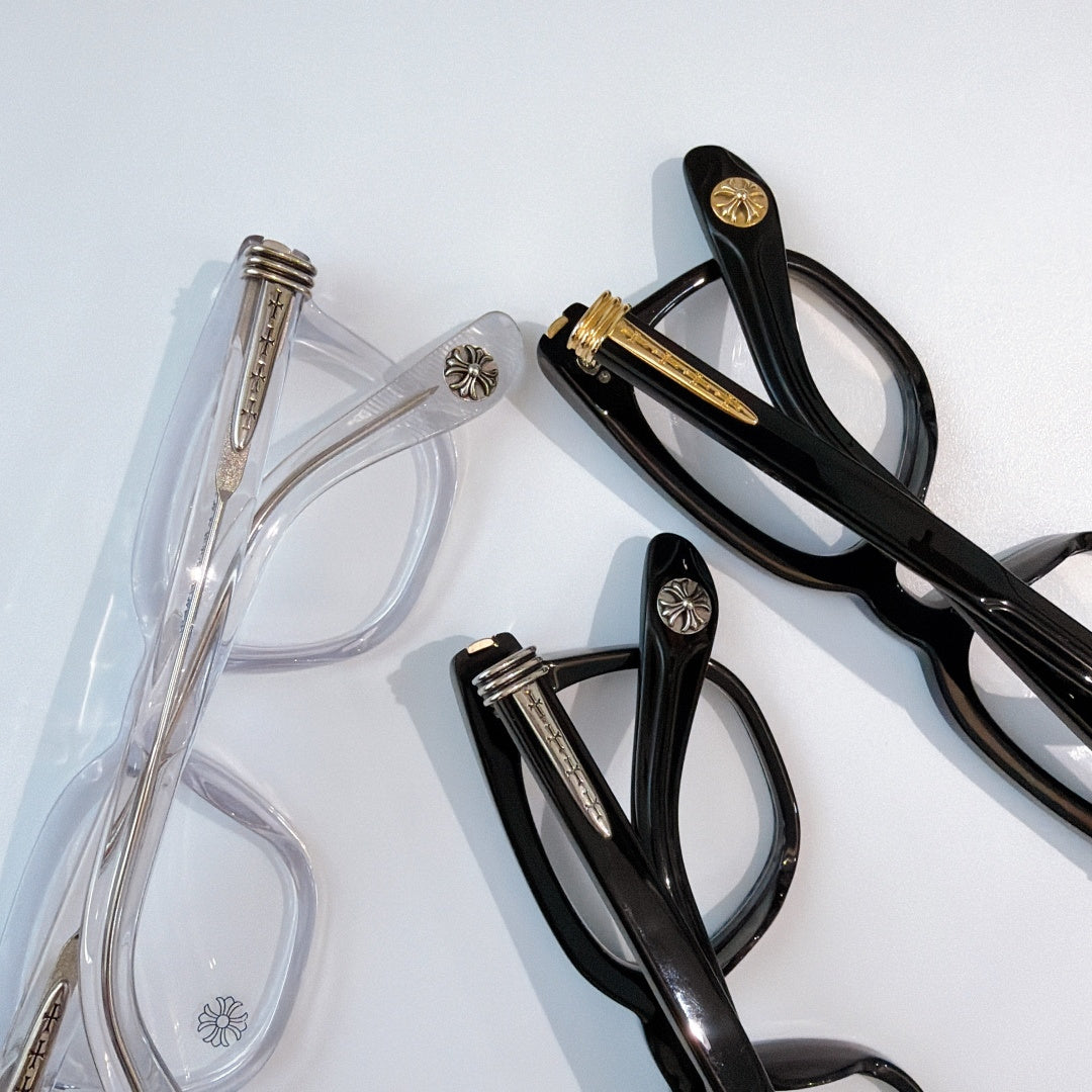 Black and transparent eyeglasses with clear lenses, shown side by side.