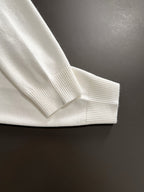White Versace sweatshirt cuff close-up with ribbed collar and knit hem