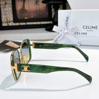 Celine sunglasses showing green temple with gold logo detail and clear bridge.