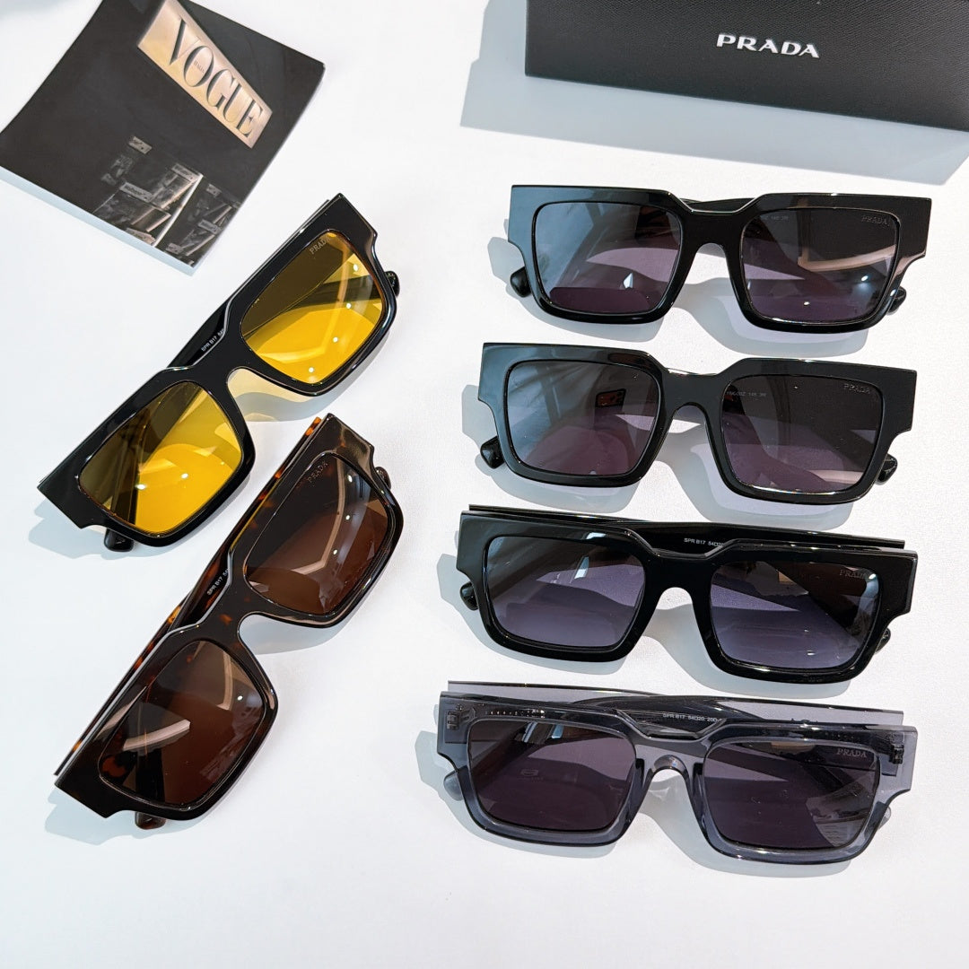 Prada sunglasses collection on display, assorted frames with tinted lenses
