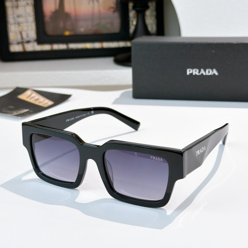 Prada sunglasses with dark frame and purple-tinted lenses, wide rectangular