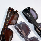 Prada sunglasses set with assorted frames and tinted lenses, close-up