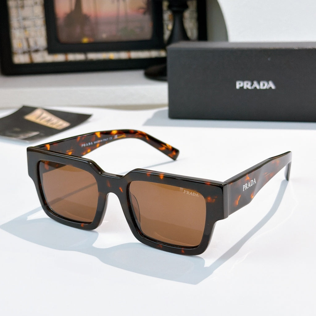 Prada sunglasses with tortoiseshell frame and brown-tinted lenses, square