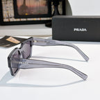Prada sunglasses side view with dark frame and purple-tinted lenses