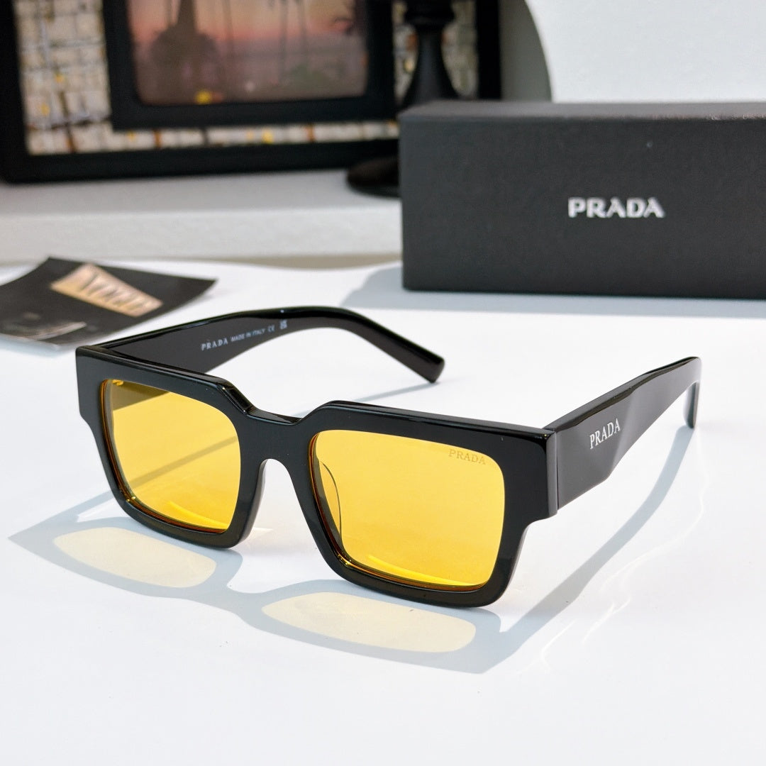 Prada sunglasses with dark frame and yellow-tinted square lenses