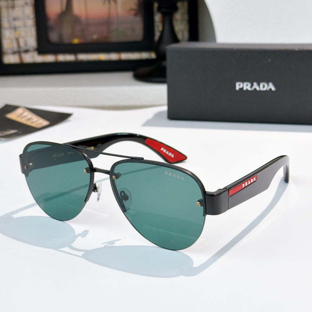 Aviator sunglasses with dark teal lenses and black frame, red logo temple detail