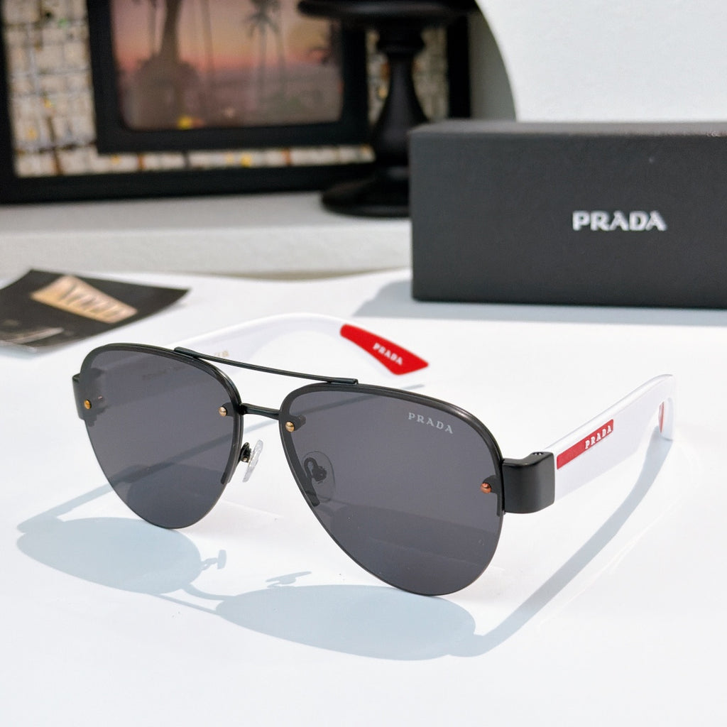 Aviator sunglasses with dark lenses and black frame, red logo temple detail