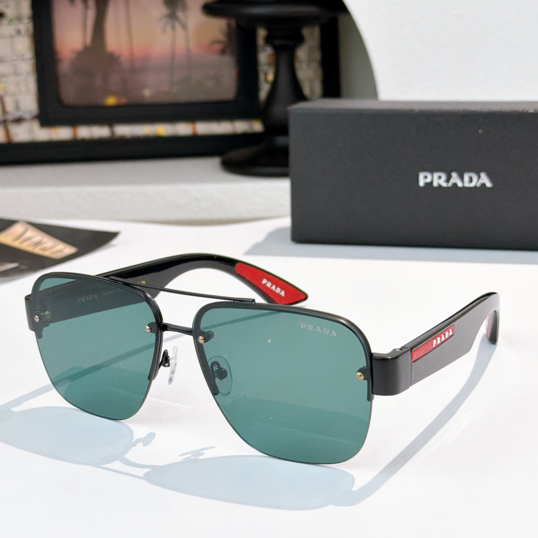 Prada aviator sunglasses with black frame and green gradient lenses