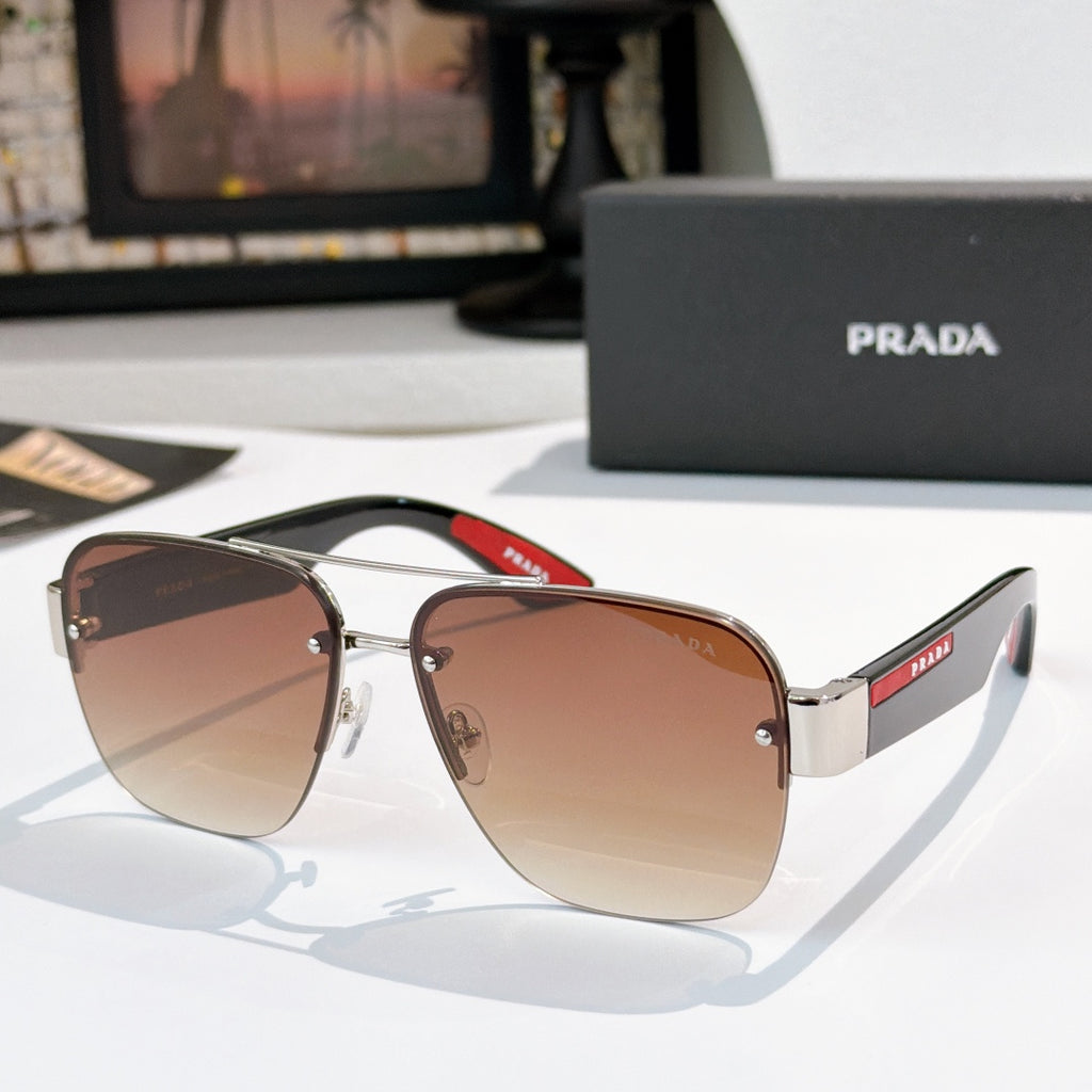 Prada aviator sunglasses with silver frame and light brown gradient lenses