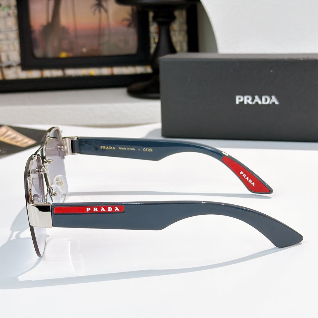 Prada aviator sunglasses with blue gradient lenses and metal arms