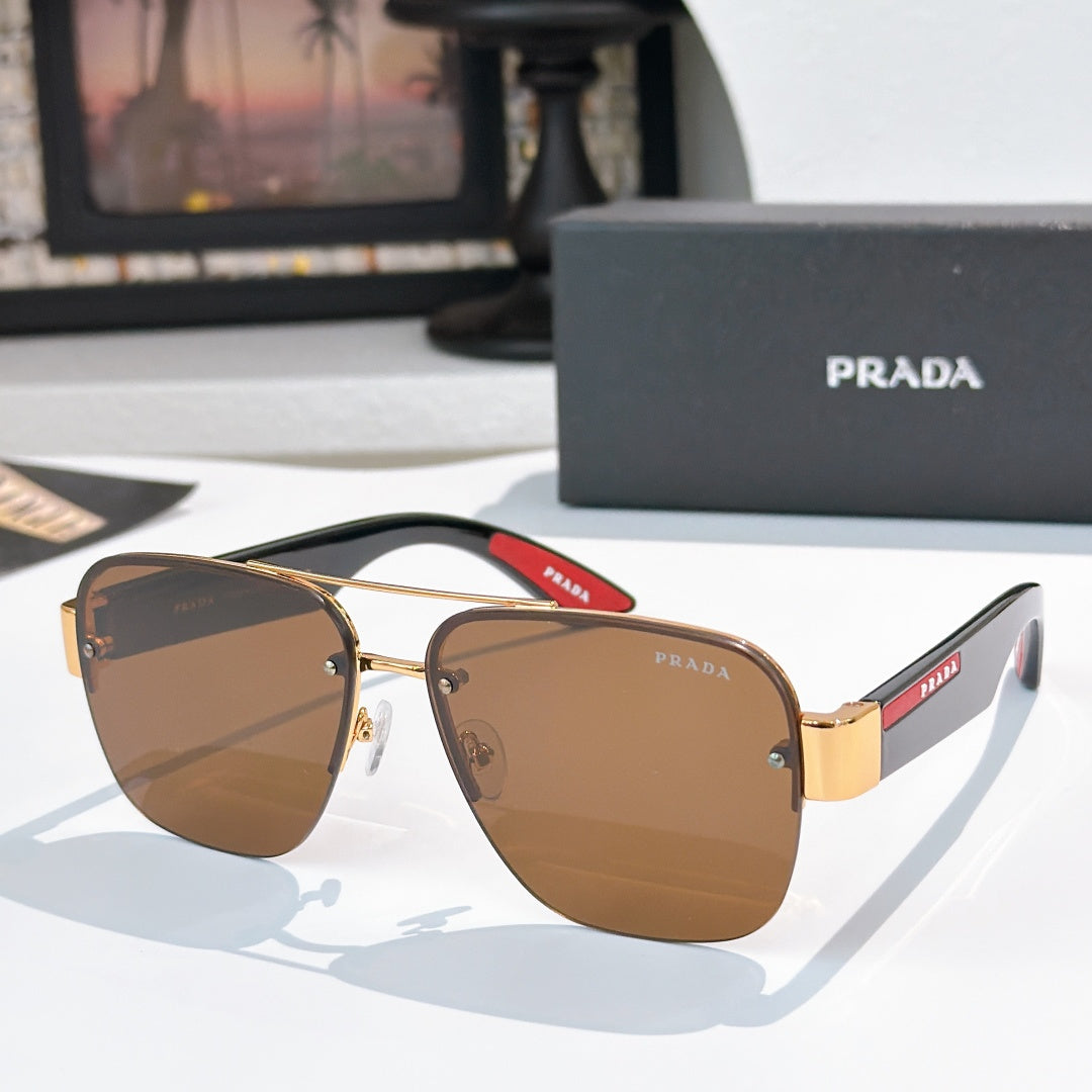 Prada aviator sunglasses with gold frame and brown gradient lenses