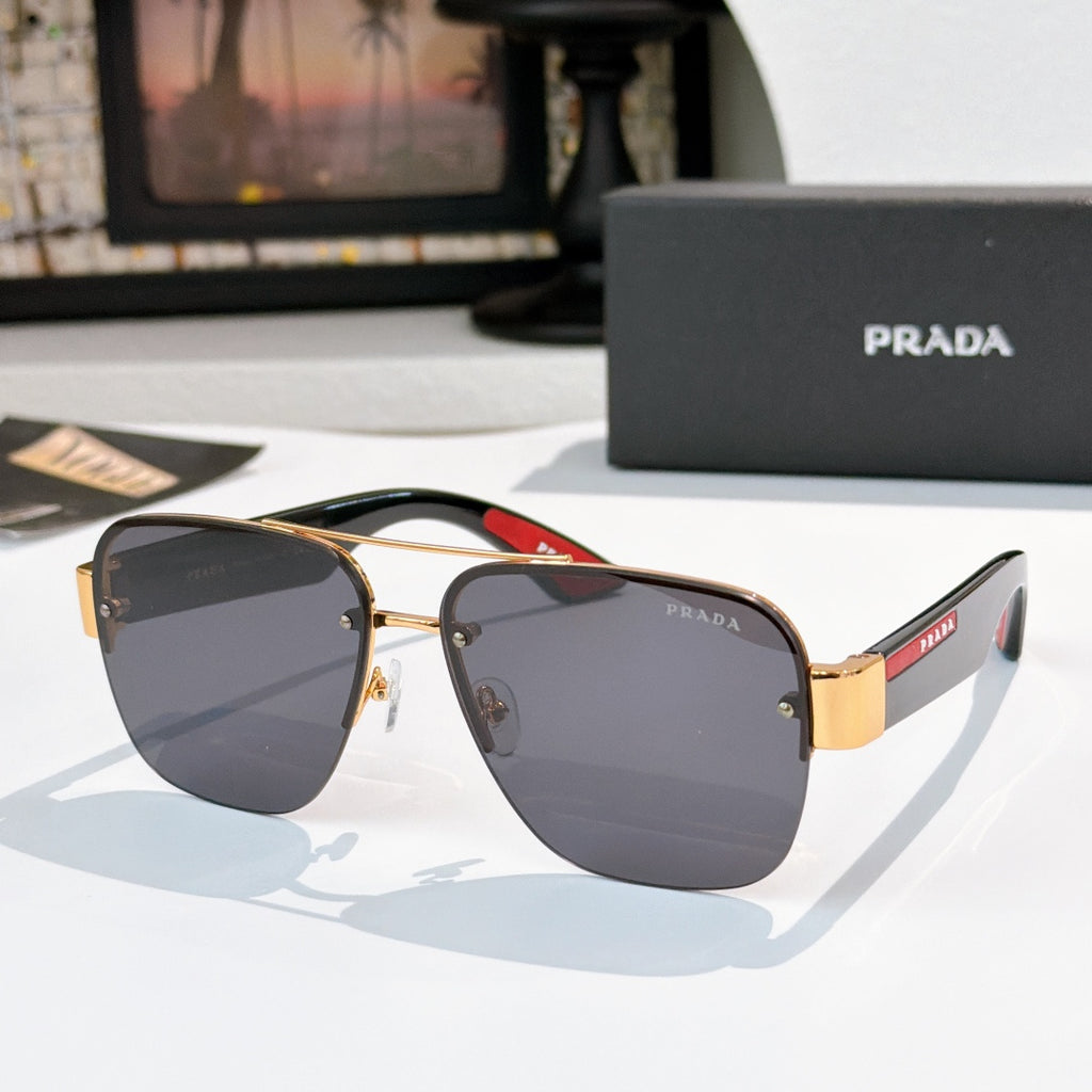 Prada aviator sunglasses with gold frame and dark gray gradient lenses
