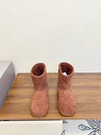 Suede ankle boots with brown uppers, open collar, and cushioned lining, pair view