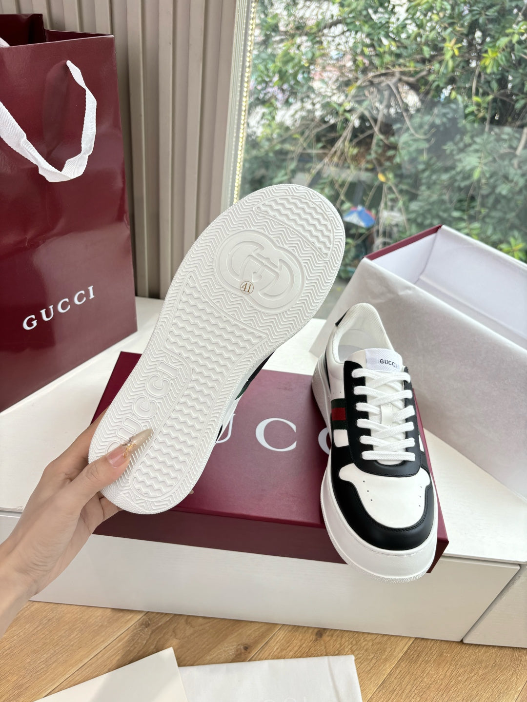 Gucci low-top sneakers with textured white outsole, black and white upper