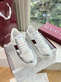 White Gucci leather sneakers with red and green side stripe, white laces, low profile
