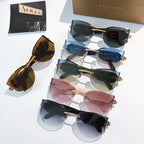 Bvlgari sunglasses display with multiple cat-eye styles in mixed frame colors.
