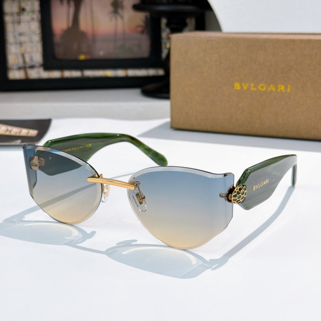 Bvlgari cat-eye sunglasses, green frame, blue gradient lenses, gold hinge emblem.