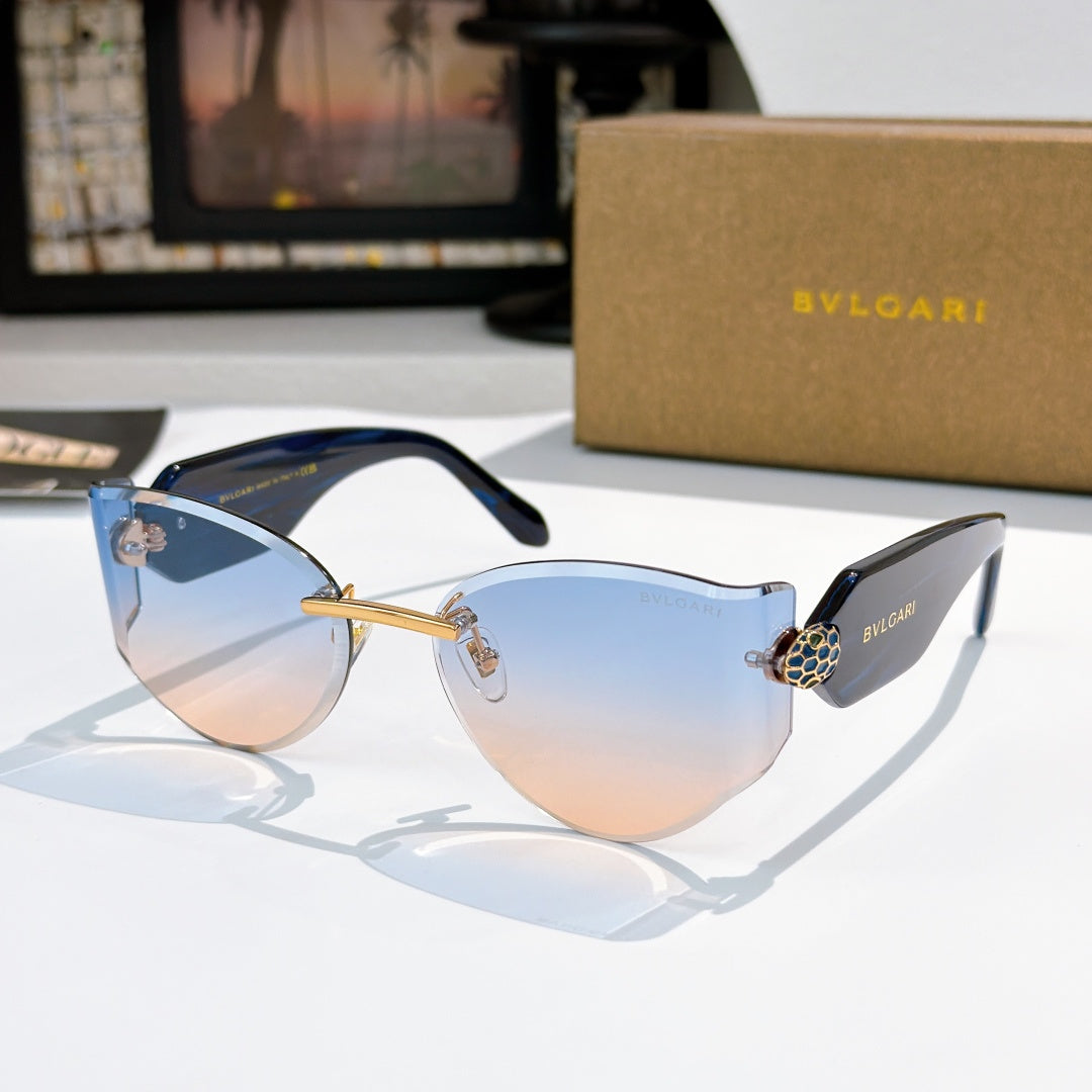 Bvlgari cat-eye sunglasses, light blue frame, gradient lenses, gold bridge hardware.