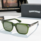 Sunglasses with green-tinted lenses, green frame, and silver ornate temple details.