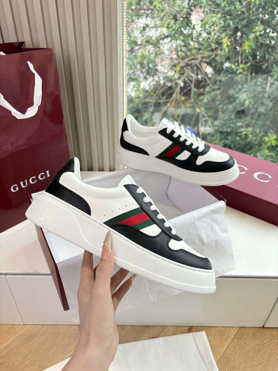 Gucci low-top sneakers, white uppers with black toe cap and multicolor web stripe