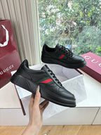 Gucci women's black leather sneakers with lace-up uppers and side stripe details