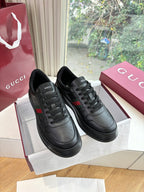 Gucci women's black leather sneakers, lace-up design with side stripe detail