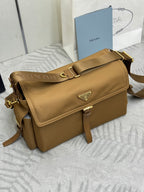 Tan flap crossbody bag with gold-tone hardware and adjustable shoulder strap