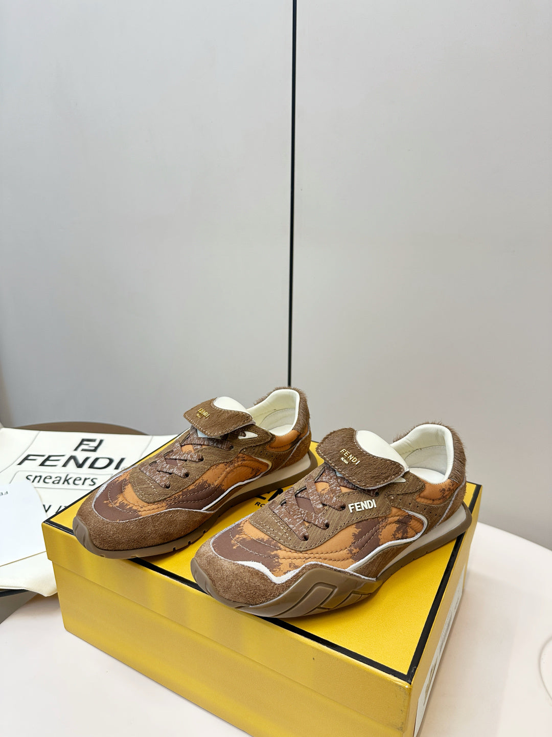 Fendi unisex sneakers, brown lace-up style with branded heel tab and cushioned tongue