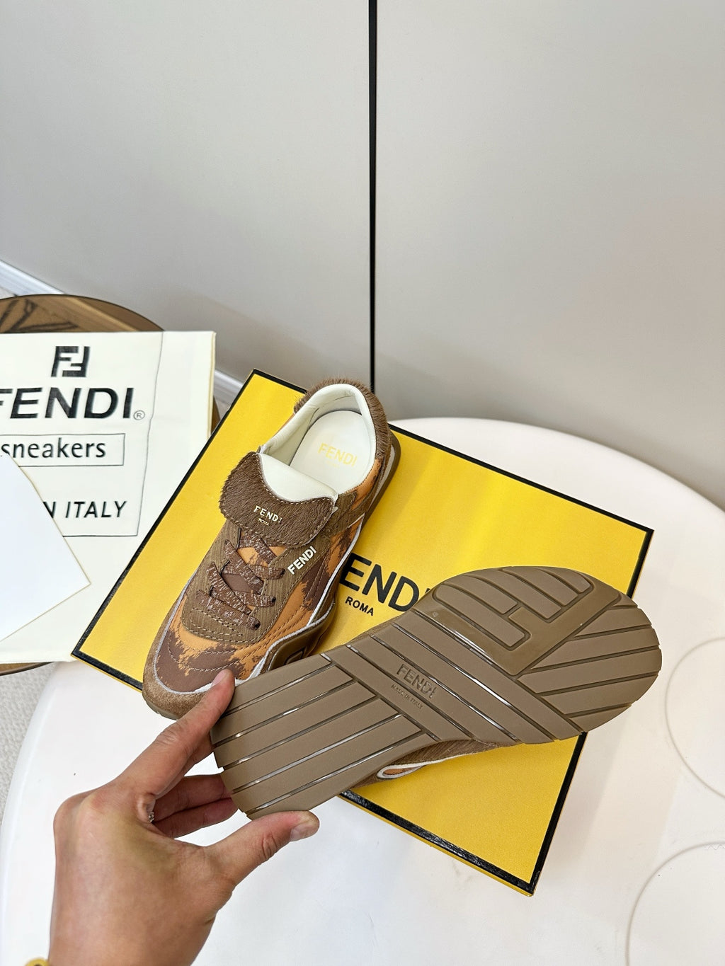 Fendi unisex sneakers sole view, brown outsole with tread pattern